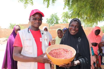 Mercy Corps employee with community member.
